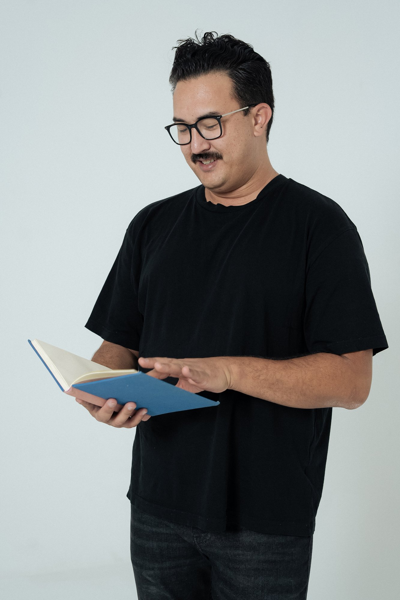 Kendall from RevImpact looking at notebook while planning client strategy